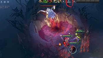 Hősök harca Roshan ellen a Dota 2 játékban egy sötét barlangszerű területen.